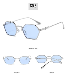 Detailed close-up of hexagonal sunglasses with silver frames and embossed cross on temples