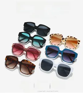 Detailed overhead view showing seven colorful square frame sunglasses in various patterns