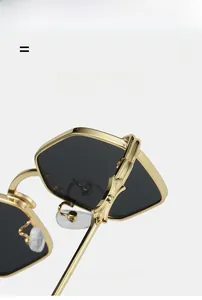 Detail of polygonal gold frame sunglasses with textured elastic temples and dark lenses