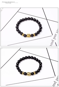 Detail of 8mm lava stone and agate bracelets with gold Buddha head and ornate spacers