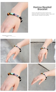 Macro detail of Hamsa Hand charm on volcanic stone and colorful gemstone bead bracelet