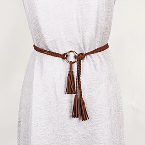 Women's brown braided waist belt with golden ring buckle and tassels on silver dress