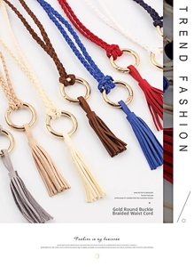 Close-up of handmade braided waist ropes with gold metal rings and fringe tassels