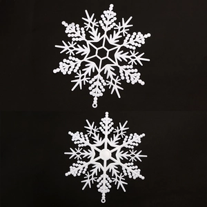 White hollow plastic snowflake ornaments for Christmas tree and festive scene decoration