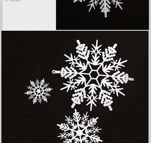 Macro detail of white plastic snowflakes with bead texture and pre-drilled hanging holes