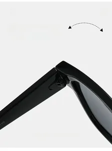 Detail view of durable metal hinge on black flat-top sunglasses for smooth folding