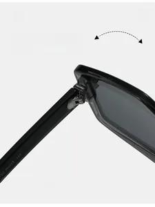 Macro view of durable metal hinge on black geometric sunglasses with frame specifications
