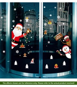 Detail of Christmas window clings featuring Santa, reindeer, and snowflakes for glass decor