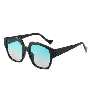 Chic oversized square sunglasses with black thick frames and blue-green gradient lenses