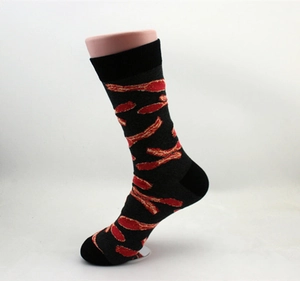 Detail of cotton crew socks with creative red bacon pattern print on black knit base