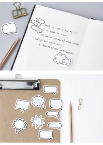 Detail showing hand-drawn speech bubble stickers and vintage journal stationery decor