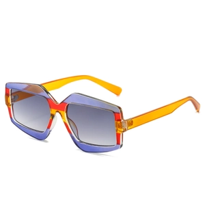 Fashionable oversized sunglasses with geometric purple and orange color-blocking frames