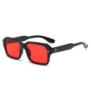 Retro square black sunglasses with red lenses and gold arrow accents on white background