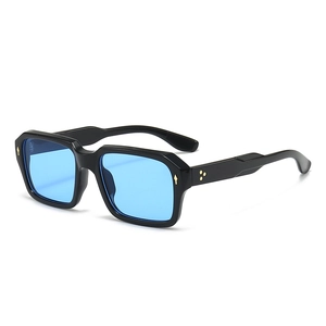Retro square black sunglasses with blue lenses and gold rivet accents on white background