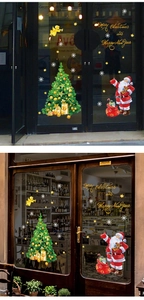 Detailed Christmas tree and Santa Claus decals on shop window for festive decoration
