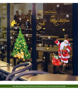 Detail of Christmas tree and Santa window stickers with Merry Christmas text on glass