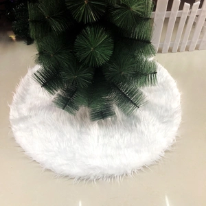 Close-up of soft white faux fur plush Christmas tree skirt with fluffy texture