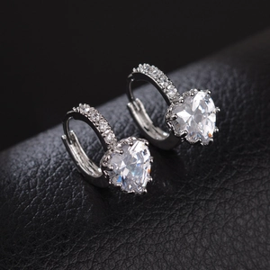 Classic silver heart-shaped cubic zirconia huggie earrings with pave accents