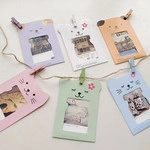 Set of 6 colorful hanging paper photo frames with cute animal designs and mini wooden clips
