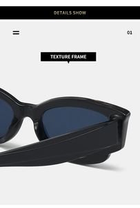 Close-up of modern black texture frame sunglasses with a polished finish and dark lenses
