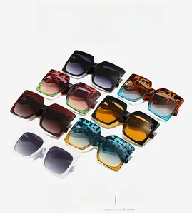 Close-up of stylish oversized square sunglasses in multiple trendy colors and patterns
