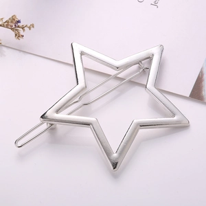 Detailed close-up of a silver hollow star hair clip with a polished glossy metallic finish
