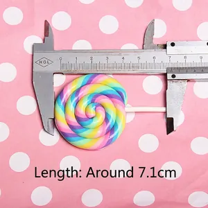 Colorful large rainbow spiral polymer clay lollipop charm measured at 7.1cm length