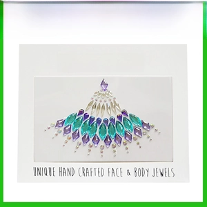Detailed view of purple and green crystal stickers for face and body decoration