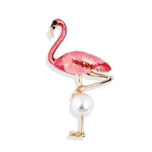 Detailed view of pink enamel flamingo brooch with gold plating and pearl accents