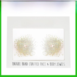 Detail of self-adhesive iridescent rhinestone body jewels in a floral pattern design