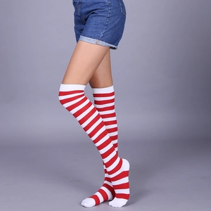 On-leg view of red and white striped over-the-knee socks with knitted texture