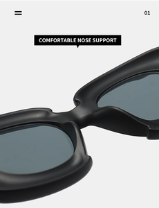 Macro detail of ergonomic wide nose support on these black square matte sunglasses