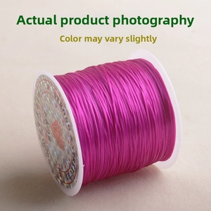 Macro view of strong stretchy rose red crystal string for DIY jewelry beading on spool