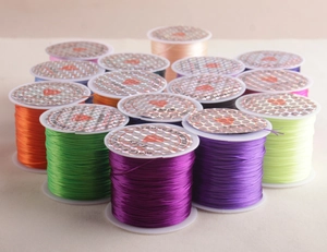 Close-up of colorful polyrethane elastic beading cords in various vibrant shades