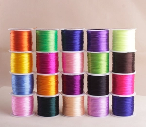 Matrix display of twenty vibrant elastic crystal strings for DIY jewelry making