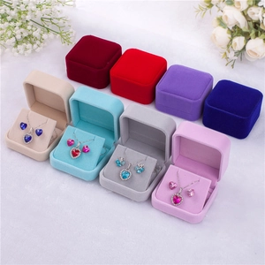 Velvet jewelry boxes in multiple colors with heart-shaped crystal necklace sets