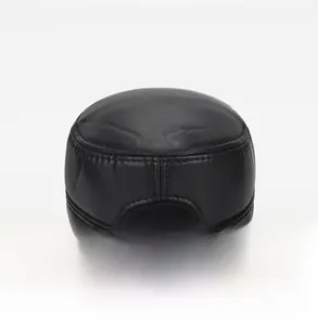Rear view of black leather flat top cap showing adjustable metal buckle and stitching