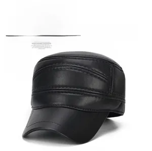 Detail of black faux leather flat top cap with parallel stitching and windproof texture