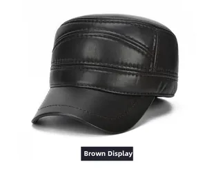 Detail of brown leather flat top hat featuring reinforced stitching and fine texture
