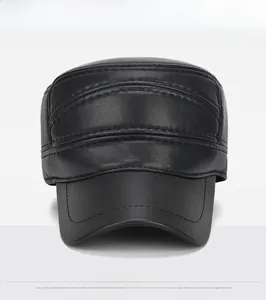 Detail view of the black leather flat top cap featuring premium stitching and durable texture