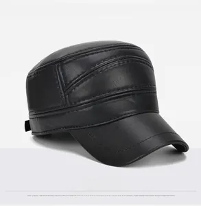 Detail view of black faux leather cadet cap showing decorative stitching and pebble texture