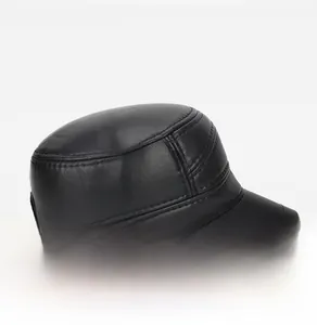 Detail view of black faux leather military cap showing side buckle and stitch texture