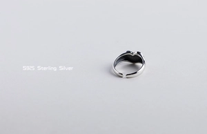 Detail of S925 sterling silver band showing smooth texture and high polish finish
