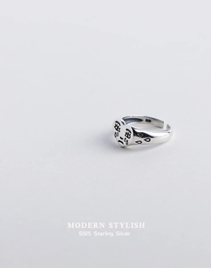 Detail of S925 sterling silver crying heart ring with modern stylish engraving