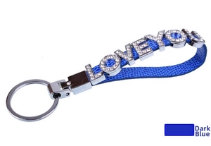 Detail of navy blue faux leather keychain with LOVE YOU slogan in sparkling white rhinestones