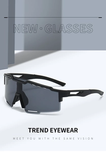 Detail view of sports sunglasses featuring black frames and gray polarized wrap lenses