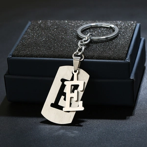Brushed stainless steel letter E keychain gift set in a black lined presentation box