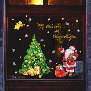 Festive Christmas window decals featuring Santa, a decorated tree, and golden stars
