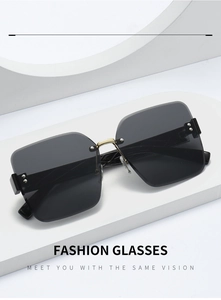 Detail of square rimless sunglasses with gold accents on white geometric stand
