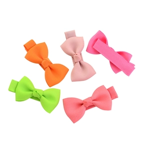 Five colorful handmade grosgrain ribbon bow hair clips for girls on a white background